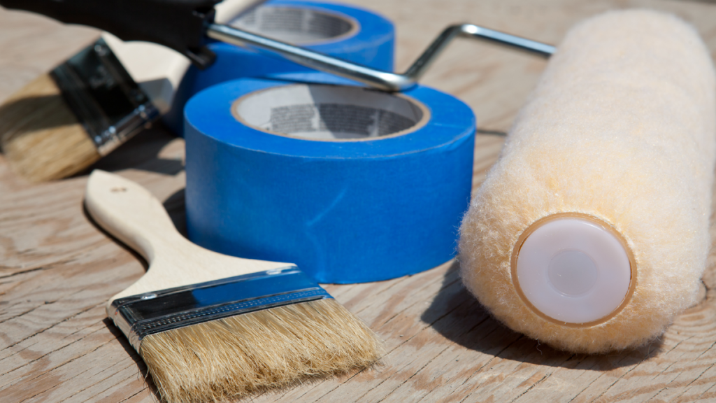 A painting brush and painter’s tape