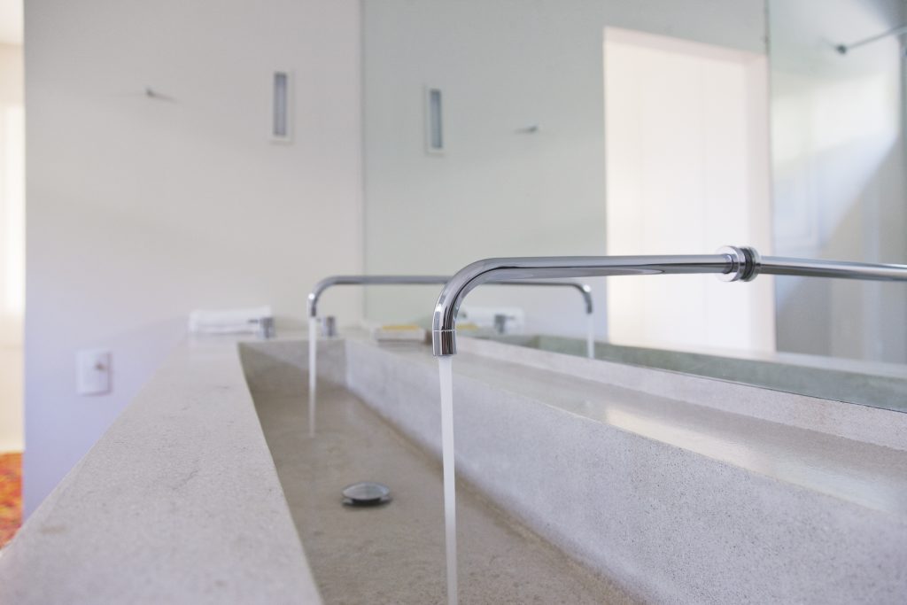 Trough sink with two running faucets